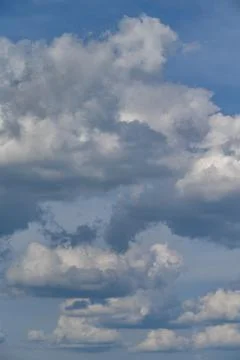 Blue sky with fluffy clouds Stock Photos