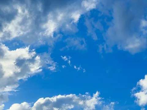 Blue Sky With Fluffy Clouds Fotos Stock