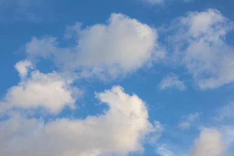 Blue Sky With Fluffy Clouds Stock Photos