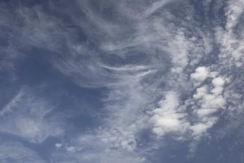 Blue sky with fluffy cumulus clouds Stock Photos