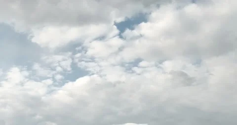 Blue sky with fluffy white clouds changes to dark evening clouds Stock Footage 155163490