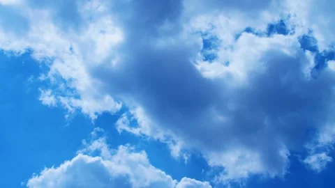 Blue sky with fluffy white clouds timelaps Stock Footage 327592321