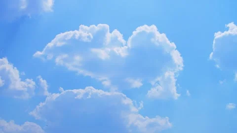 Blue sky with fluffy white clouds on a bright sunny day Time Lapse Stock Footage 328827444