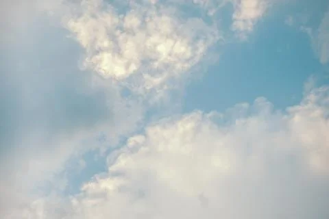Blue sky with fluffy white clouds Stock Photos