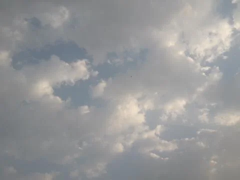 Blue sky with fluffy white clouds Stock Photos