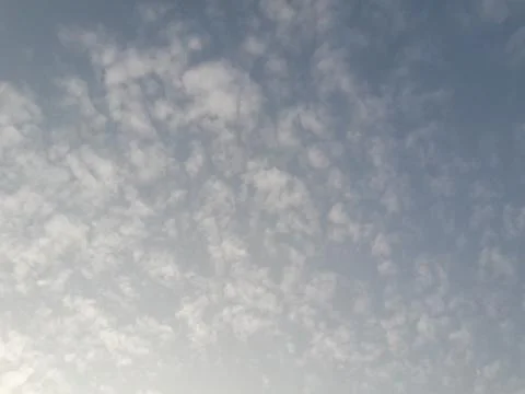 Blue sky with fluffy white clouds Stock Photos