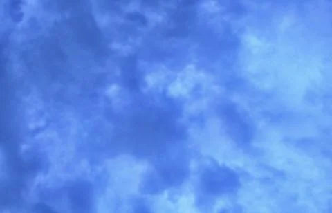 Blue Sky with Fluffy White Clouds Stock Photos