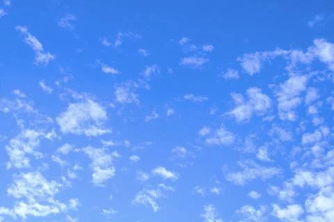 Blue Sky with Fluffy White Clouds Stock Photos