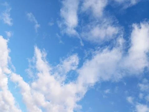Blue Sky with Fluffy White Clouds Stock Photos