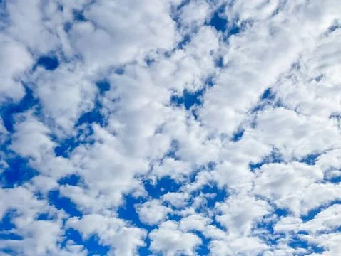 Blue Sky with Fluffy White Clouds (Background Texture) Stock Photos