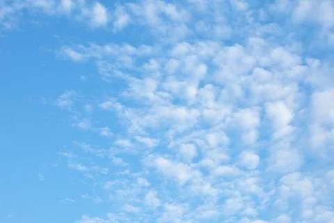 Blue Sky with Fluffy White Clouds Stock Photos