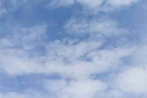 Blue sky with fluffy white clouds on summer day Photos