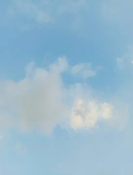 Blue sky with fluffy white clouds. Stock Photos
