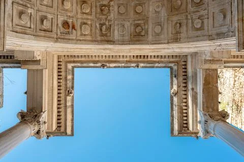 Blue sky framed by ancient Hadrian Gate arch in Antalya Stock Photos