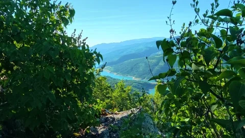 Blue sky frames green hills and river below. Kozji Kamen viewpoint, Serbia 스톡 동영상 342341029