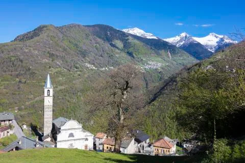 Blue sky frames the snowy peaks and the alpine village of Rasura, Orobie Alps, Stock Photos