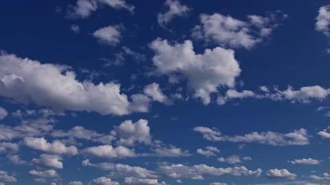 Blue sky full of moving cumulus clouds, time lapse, 6k Stock Footage 154543282