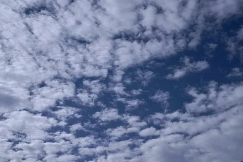A blue sky full of white clouds, sunny day Stock Photos