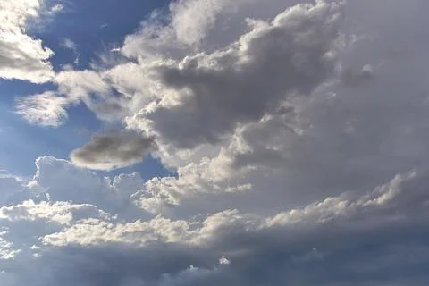 A blue sky full of white clouds, sunny day Stock Photos