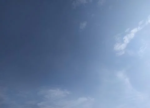 Blue Sky Gradient with Soft Clouds Background Stock Photos