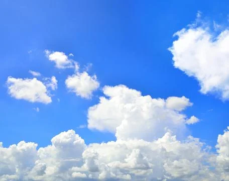 Blue sky with hearts shape clouds. Beauty natural background Fotos de archivo
