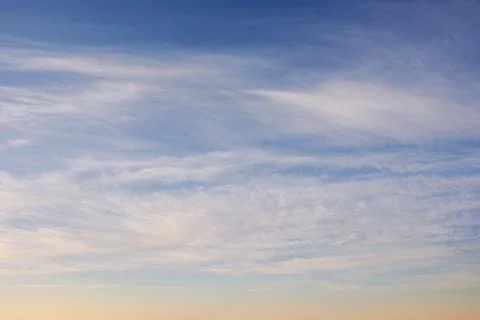 Blue sky with high clouds at sunrise Stock Photos