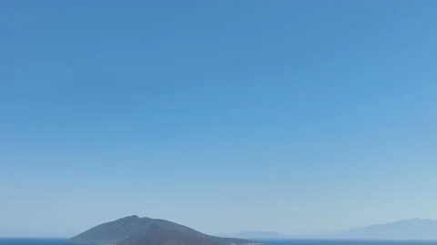 Blue sky with island camera slides to left Stock Footage 235349223