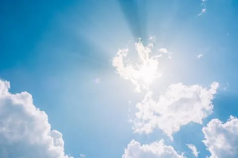 Blue sky landscape with white clouds and rays of the sun. cloudy sky, white Stock Photos