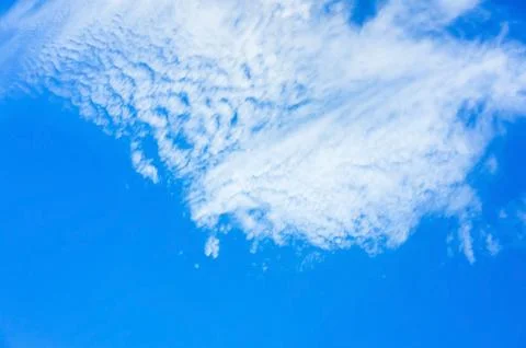 Blue sky with layer of white clouds Stock Photos