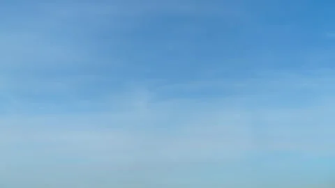 Blue sky with light soft clouds, time lapse. Clear day atmosphere with bright Stock Footage 336394272