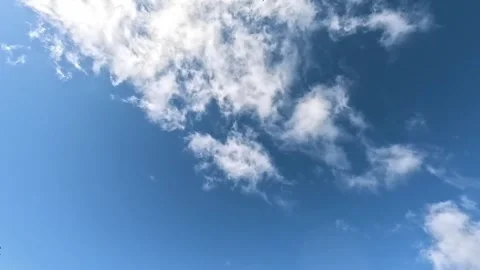 Blue sky with light white clouds on sunny day Stock Footage 318153195