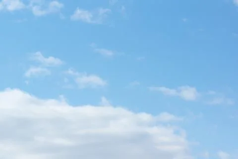 Blue sky with light white clouds Stock Photos