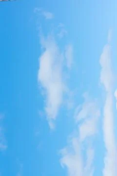 Blue sky with light white clouds Stock Photos