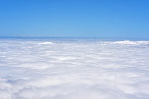 Blue sky with line of clouds. Stock Photos