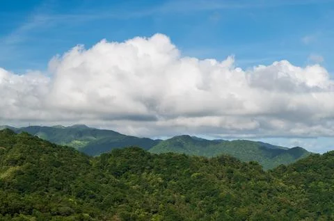 Blue Sky Majesty: Capturing the Dynamic White Clouds on the Mountain. Stock Photos