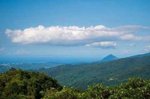 Blue Sky Majesty: Capturing the Dynamic White Clouds on the Mountain. Stock Photos