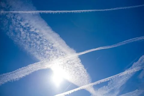 Blue sky with many clouds lines made of aircraft Stock Photos