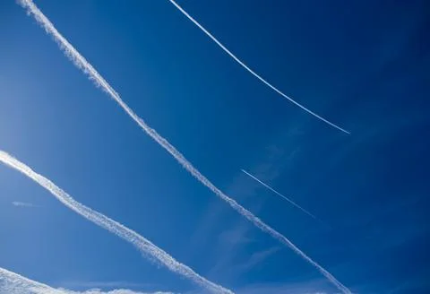 Blue sky with many clouds lines made of aircraft 스톡 사진