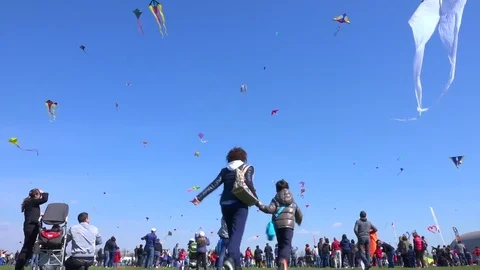 Blue sky with many kites flying during the Kite Festival. Stock Footage 70402239
