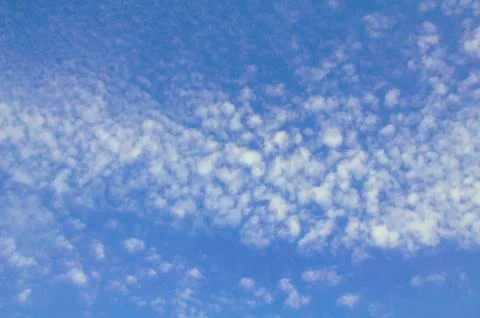 Blue sky with many small clouds Stock Photos