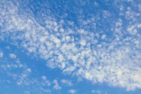 Blue sky with many small clouds Stock Photos