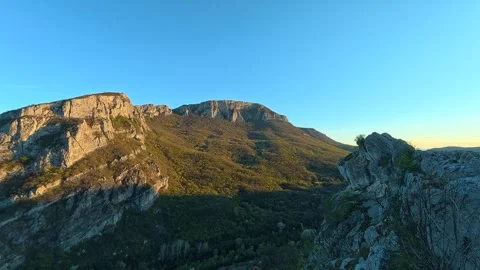 Blue sky meets rugged mountains at dawn. Sicevo Gorge, Serbia Stockbeeldmateriaal 332614539