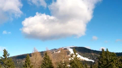 Blue sky in the middle, big clouds and autumn forest Stock Footage 256647602