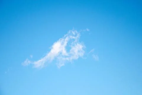 Blue sky with one light cloud Stock Photos