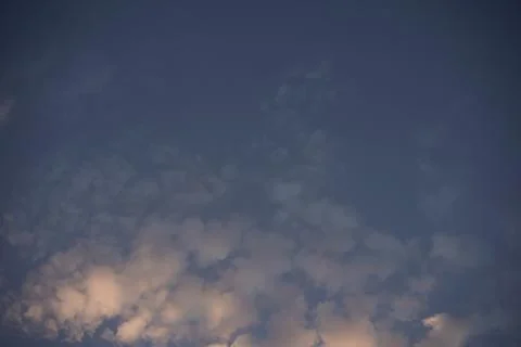 Blue sky or cloudscape, twilight time. Morning or evening sky with soft clouds Stock Photos