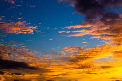 Blue sky with orange cloud Stock Photos