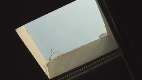 Blue sky outside the open window in the black room 스톡 동영상 163104847