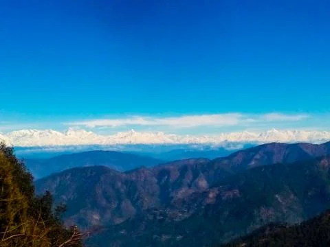 Blue sky over blue clouds on blue mountain-hills Stock Photos