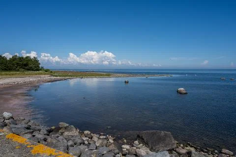 A blue sky over a calm bay in summertime. From the swedish island oland. Stock Photos