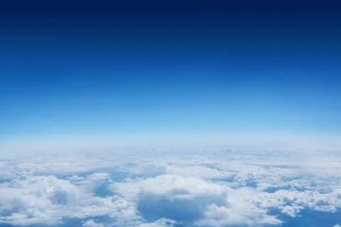 Blue sky over clouds at high altitude Stock Photos